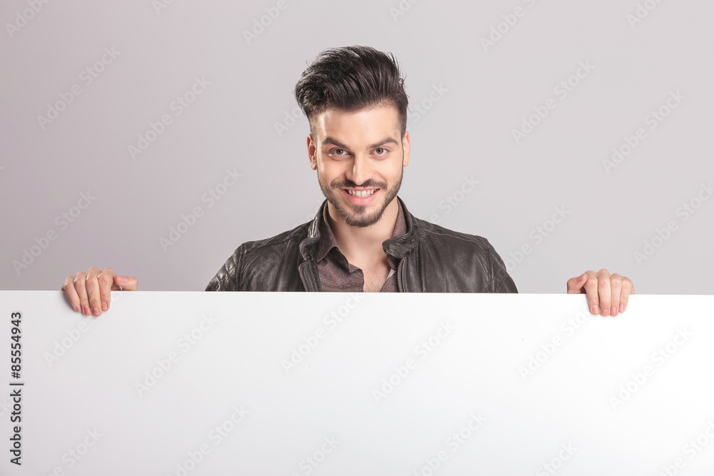 Happy young fashion man smiling to the camera Happy young fashion man smiling to the camera