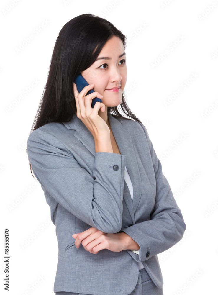 Asian businesswoman talk to mobile phone Asian businesswoman talk to mobile phone