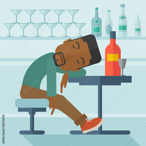 African Drunk man fall asleep in the pub.