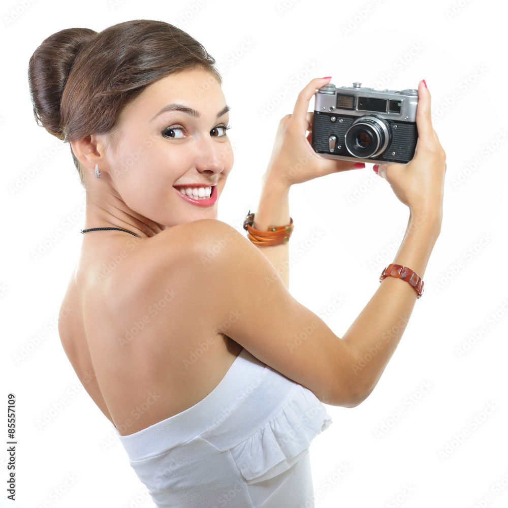 Beautiful excited girl takes picture with retro photo camera, ov Beautiful excited girl takes picture with retro photo camera, ov