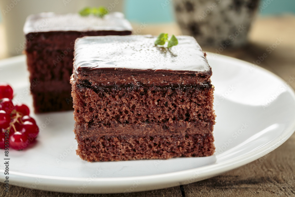 Chocolate cake cut in square shape Chocolate cake cut in square shape