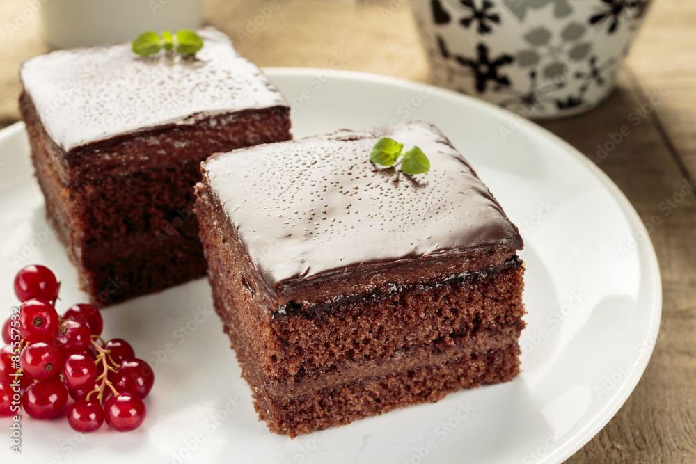 Chocolate cake cut in square shape Chocolate cake cut in square shape