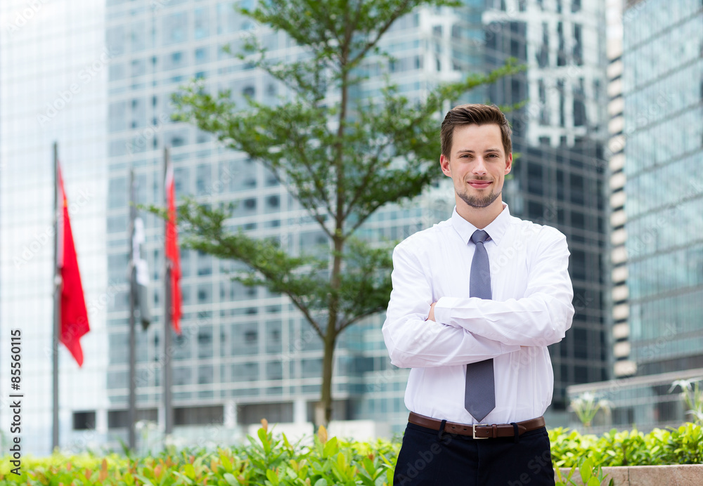 Young businessman standing at outdoor in Hong Kong Young businessman standing at outdoor in Hong Kong
