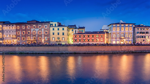 Pisa, Italy. City buildings along river Arno at dusk © jovannig