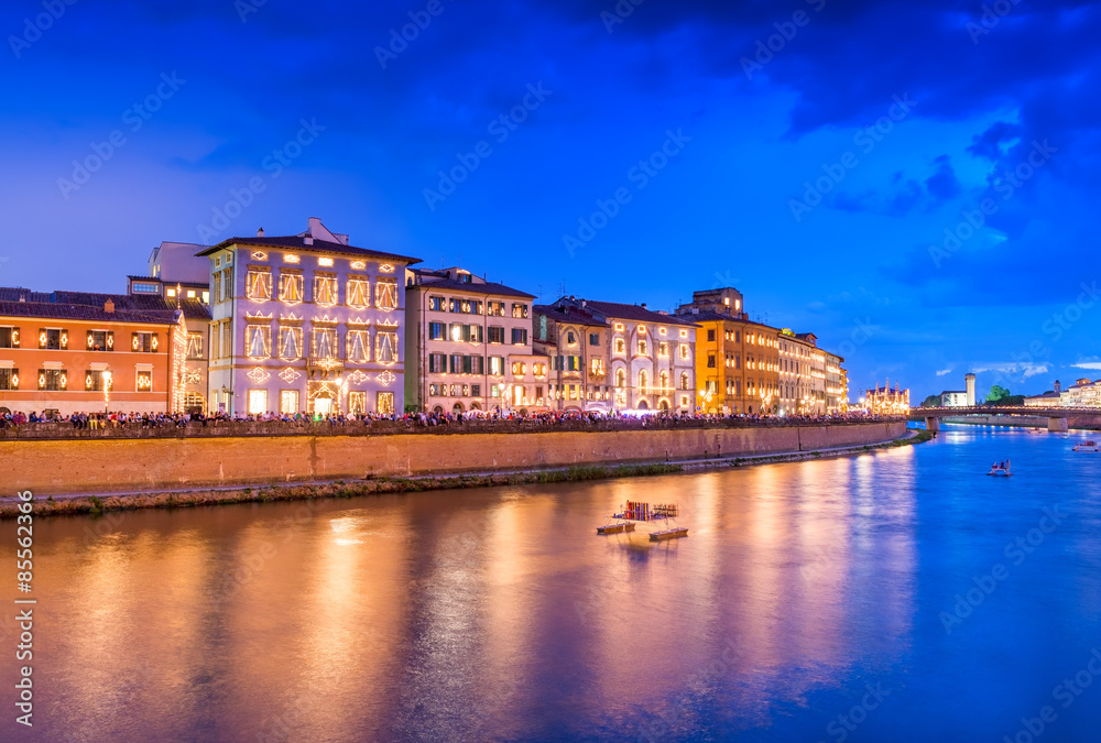 Pisa, Italy. Lungarno Gambacorti with illuminated city buildings