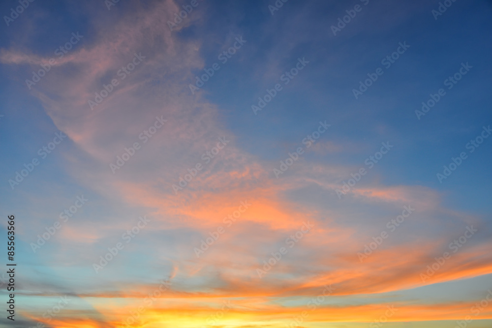 Sunset sky with orange colored clouds. 
