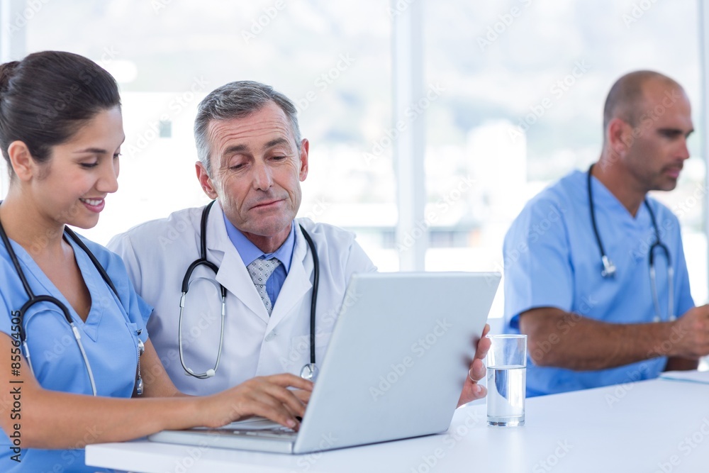 Doctors using computer Doctors using computer