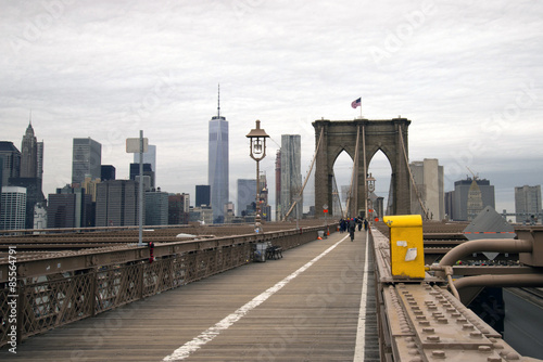 Brooklyn Bridge walkway in New York City on cloudy day