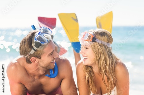 Happy couple with snorkel and flippers 
