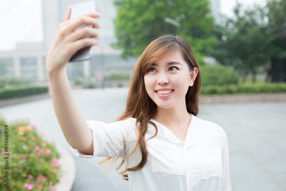 asian beautiful young woman using mobile phone to take selfie ou asian beautiful young woman using mobile phone to take selfie ou