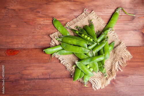 peas on wooden desk