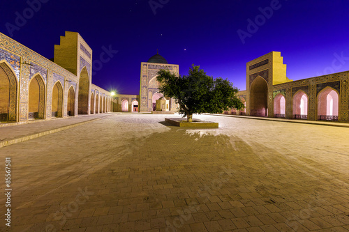 View of Kolon mosque at night, Bukhara, Uzbekistan. photo