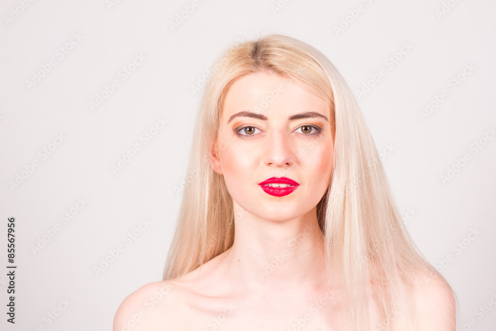Beauty concept. Beautiful woman with blond straight hair and red lips Beauty concept. Beautiful woman with blond straight hair and red lips