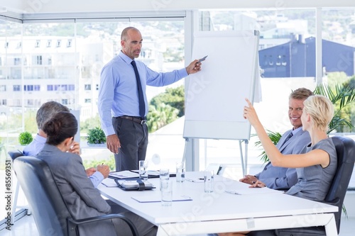 Businesswoman asking question during meeting 