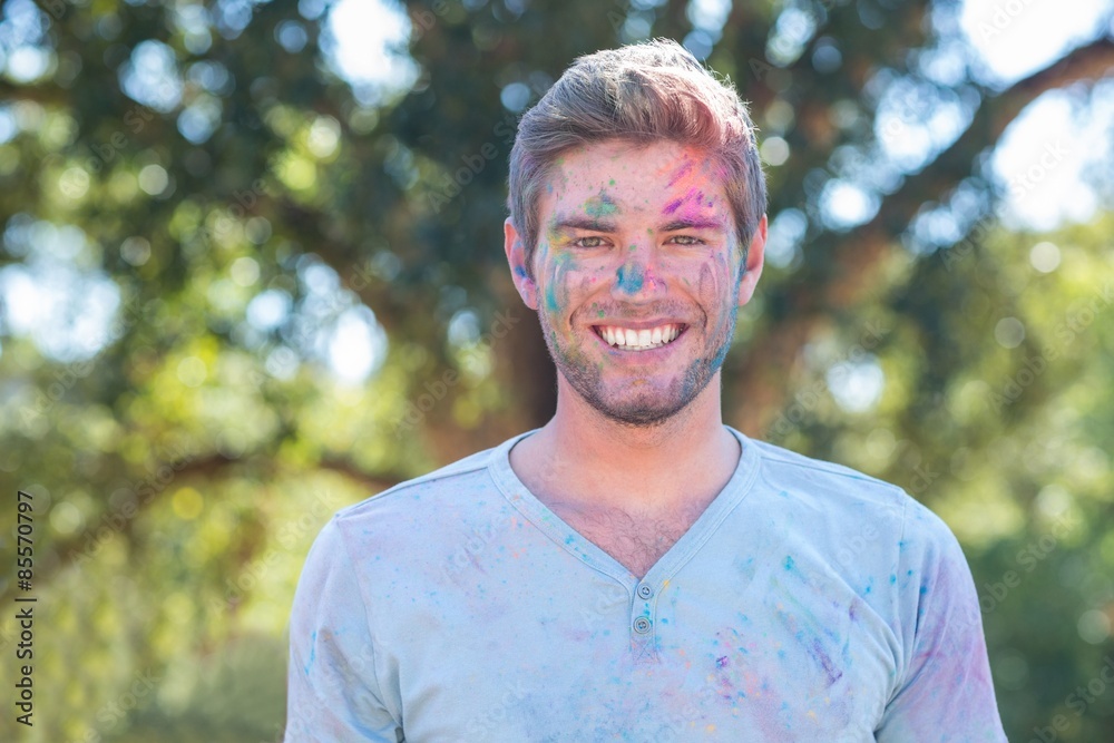 Happy man covered in powder paint Happy man covered in powder paint
