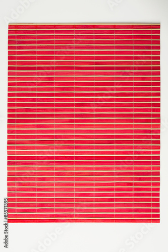 Cookbook background/Red wooden mat on white kitchen table