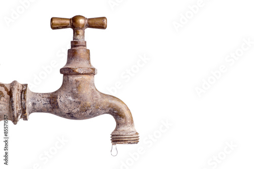 Old and used Vintage faucet with water drop photo