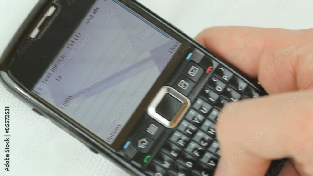 Texting a love message - Male hand typing a text message 
