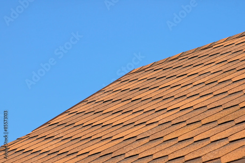 Roof of bituminous tiles.