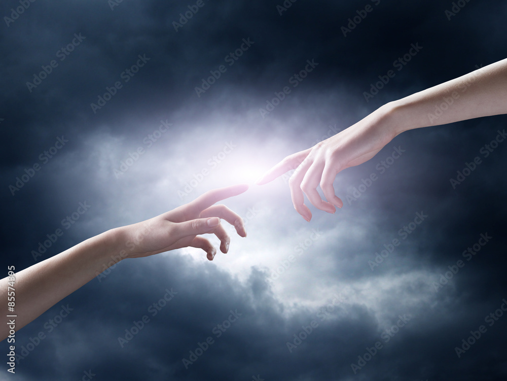 Naklejka premium religion concept. finger touching the magic sky