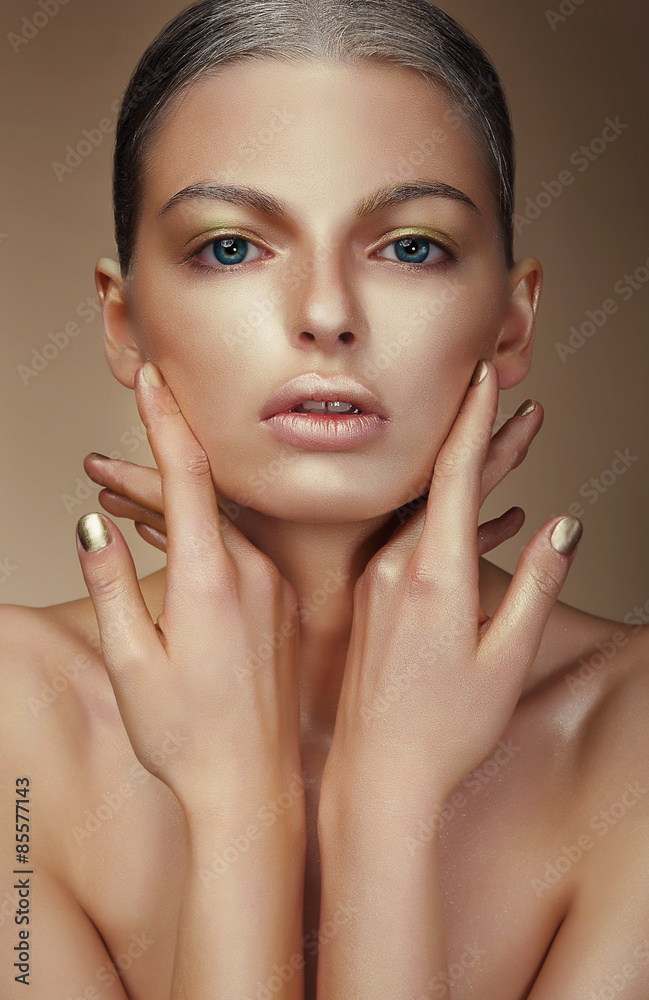 Vogue Style. Young Woman with Bronzed Skin Vogue Style. Young Woman with Bronzed Skin