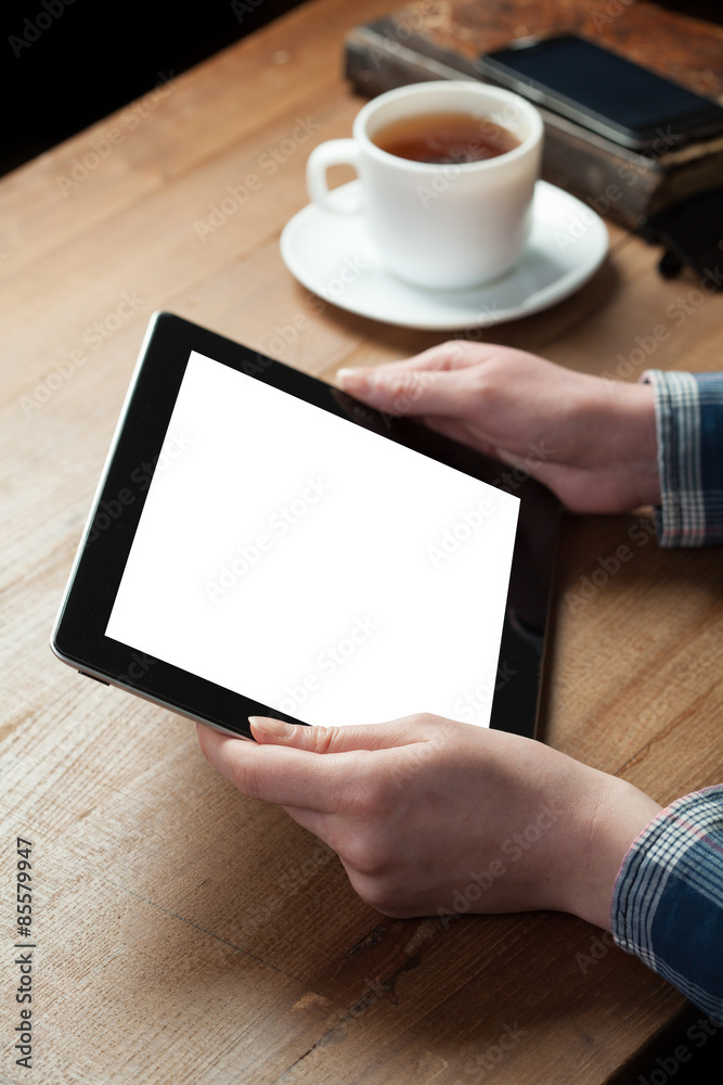 woman finger presses on screen digital tablet on wooden background. Shallow depth of field woman finger presses on screen digital tablet on wooden background. Shallow depth of field