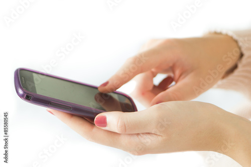 Female hands using mobile