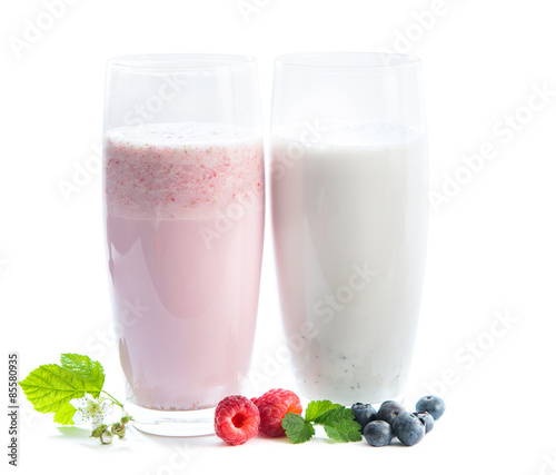 glasses of raspberry and blueberry milkshake