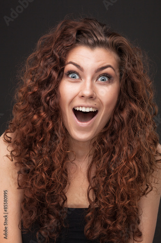 woman with healthy brown curly hair