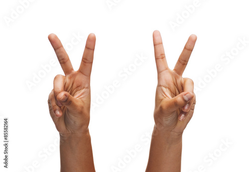 woman hands showing v-sign