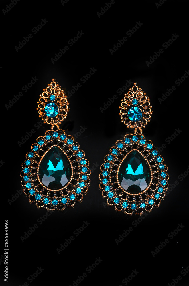blue earrings on a white background blue earrings on a white background