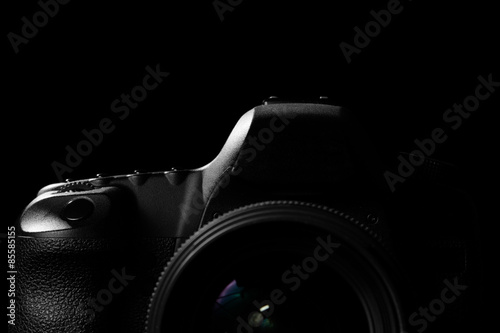 Cuadro en lienzo Image of a professional modern DSLR camera low key image - Modern DSLR camera with a very wide aperture lens on in a dark space