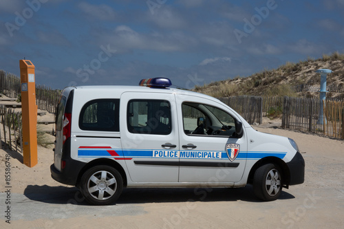 French car police doing patrol on the beach