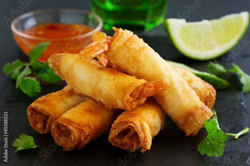Fototapeta Spring rolls with shrimp with sweet chili sauce. Asian cuisine.