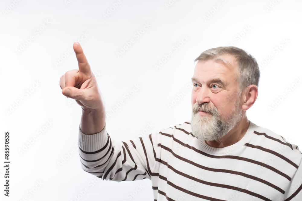 Old man with a beard is pointing Old man with a beard is pointing