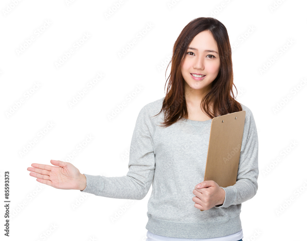Woman hold with file and open hand palm to promote something Woman hold with file and open hand palm to promote something
