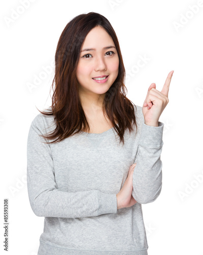 Young woman with finger point up