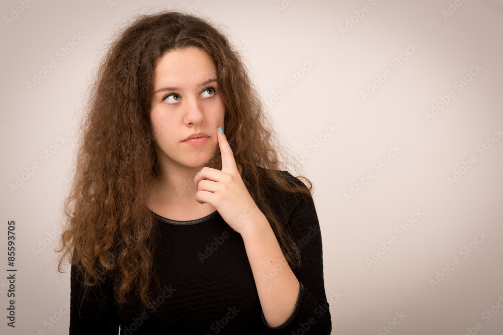 Ginger Teenage Girl In a Thoughtful Pose Looking Up Ginger Teenage Girl In a Thoughtful Pose Looking Up