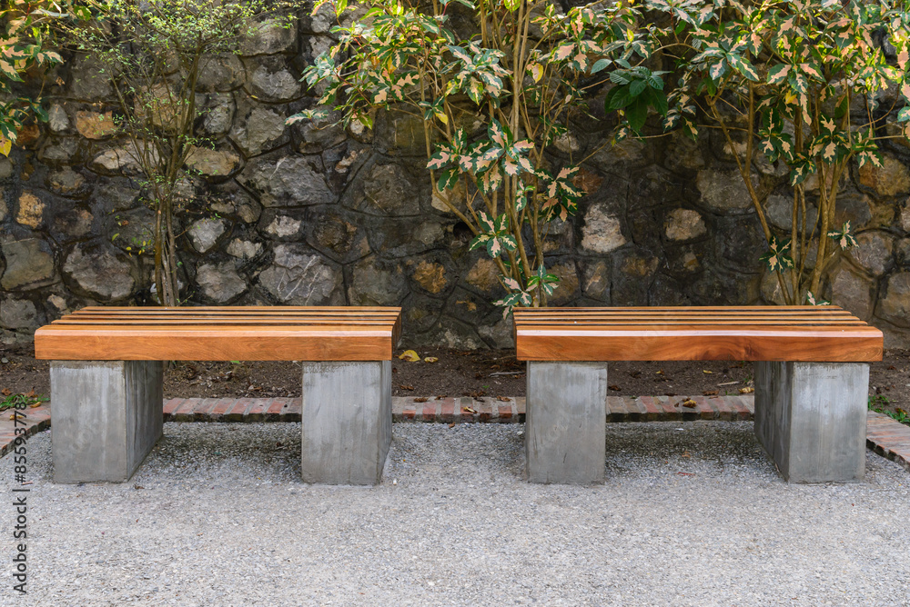 Wooden bench in public park open space. Wooden bench in public park open space.