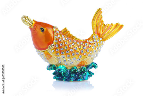 Colorful metal fancy carp have coin in mouth on white background