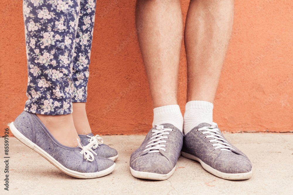Closeup foot of kissing couple outdoor at street Closeup foot of kissing couple outdoor at street