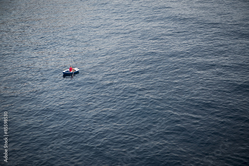 Lonely Rowboat on a Large Expanse of Sea