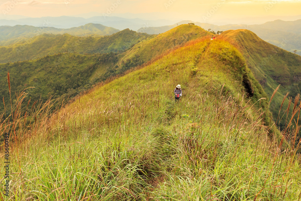 Woman hikers going to the top of the mountain, Khao Chang Puak T Woman hikers going to the top of the mountain, Khao Chang Puak T