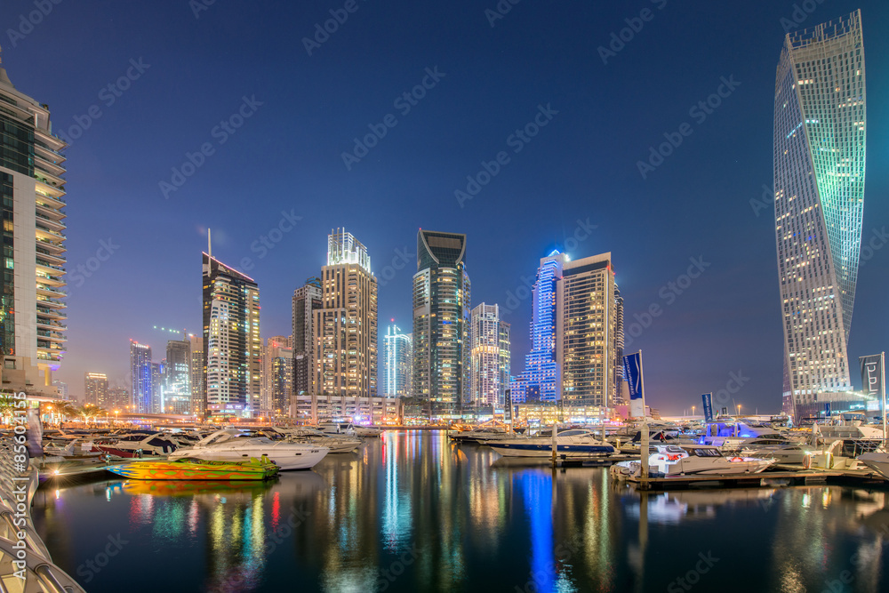 Fototapeta premium Dubai marina skyscrapers during night hours