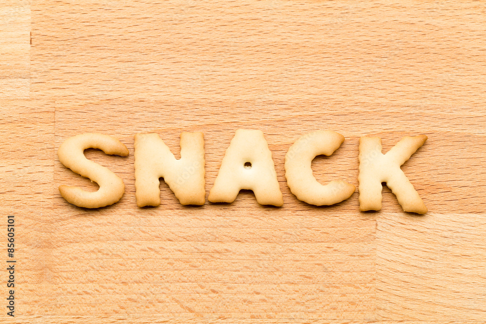 Word snack biscuit over the wooden background Word snack biscuit over the wooden background