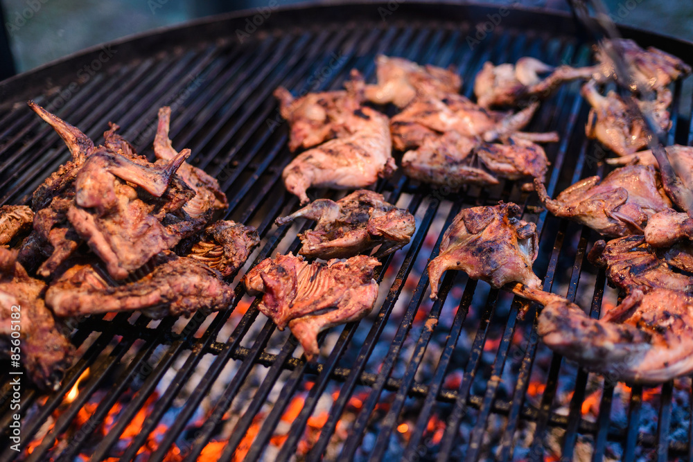 Roasted quail on grille/Roasted partridge meat over an open fire Roasted quail on grille/Roasted partridge meat over an open fire