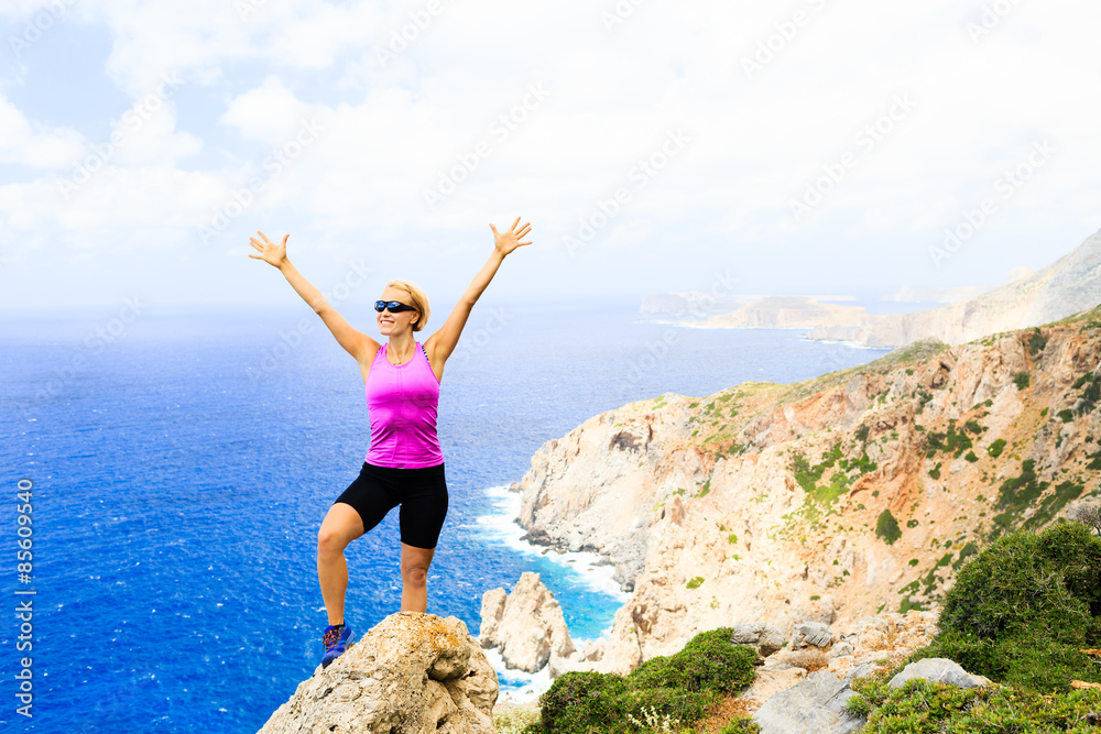 Happy climber woman winner reaching life goal success Happy climber woman winner reaching life goal success