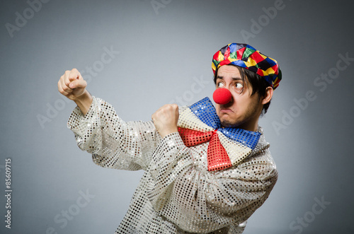 Funny clown against dark background