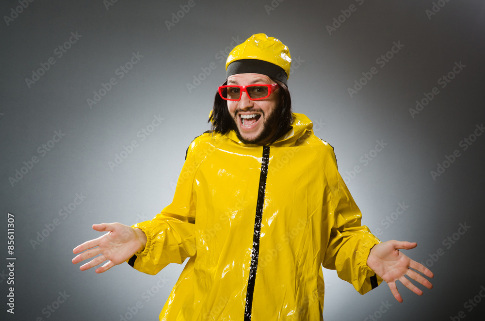 Man wearing yellow suit in funny concept Man wearing yellow suit in funny concept