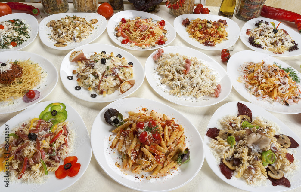 Variety of prepared pasta served on the table. Variety of prepared pasta served on the table.